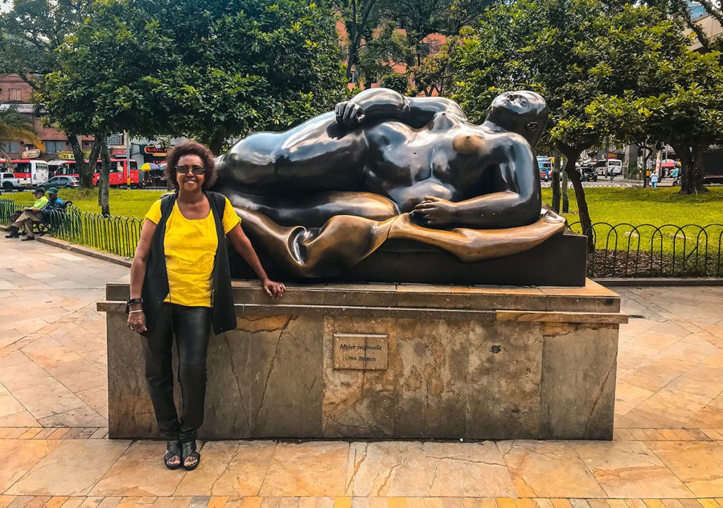 Khadija beside a reclining woman statue - Medellin
