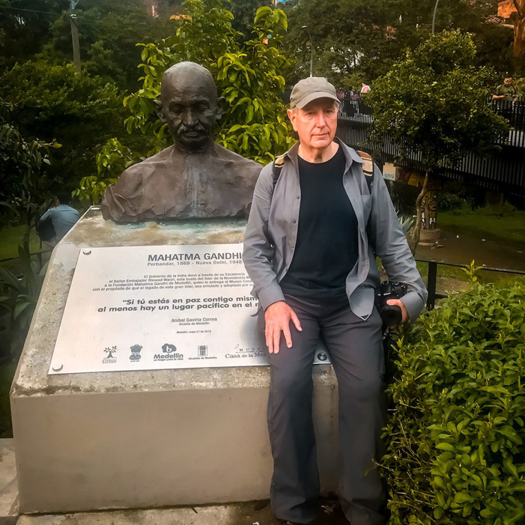 Ed beside a Mahatma Gandhi bust - Medellin