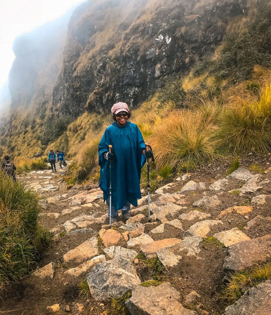 Smiling Khadija climbing the steps - Inca Trail