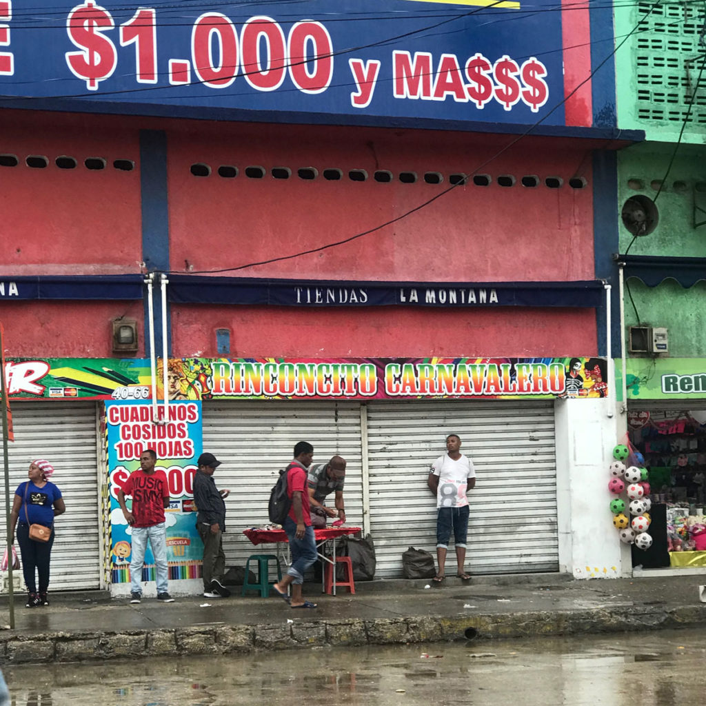 People on a rainy street - Cartagena