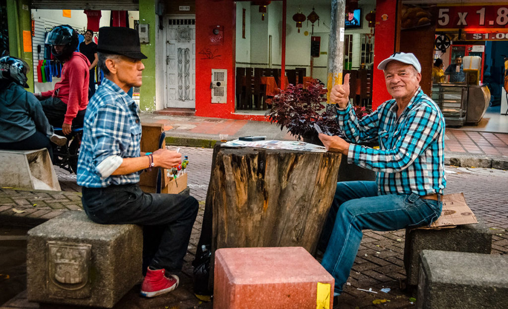 Two friends playing cards - Medellin