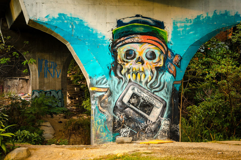 Skull graffiti on a viaduct - Medellin