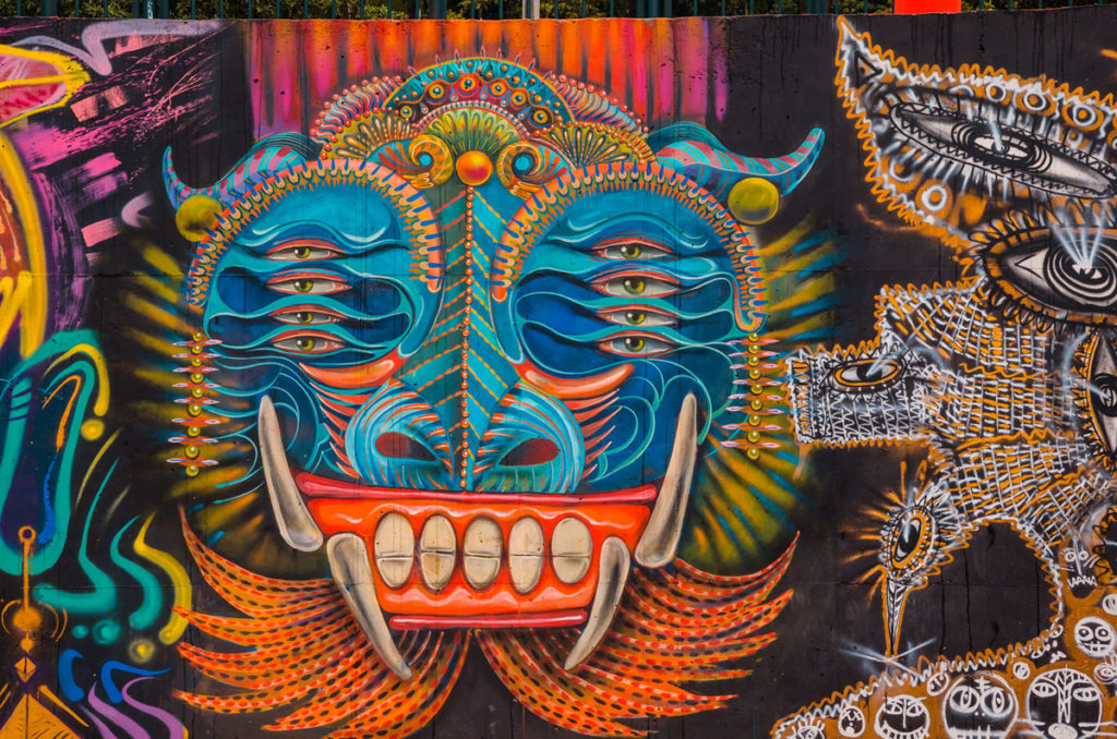 Multi-eyed face graffiti - Bogota
