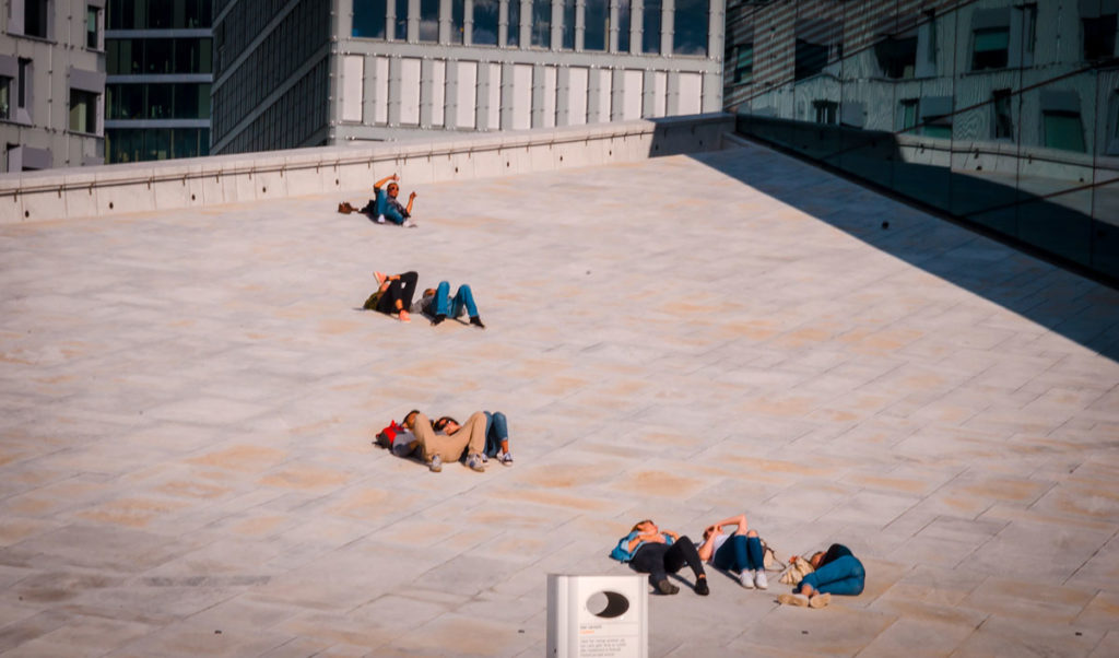 People relaxing at the roof of Oslo Opera House - Oslo