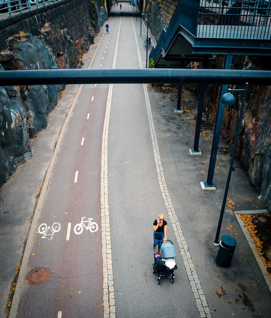 Woman and baby along a bicycle path - Helsinki
