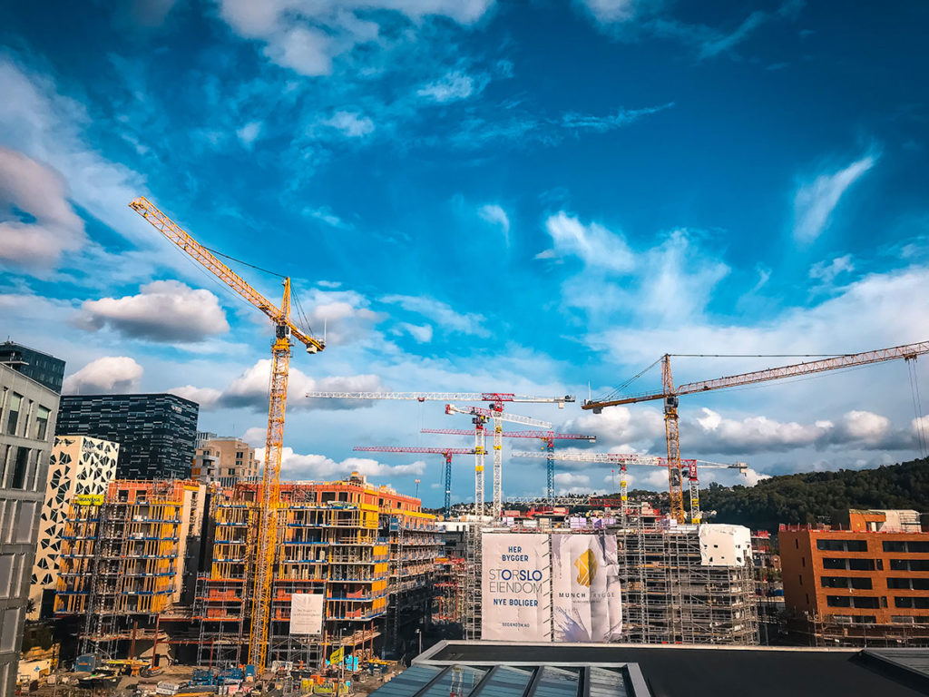 View of cranes and buildings under construction - Oslo