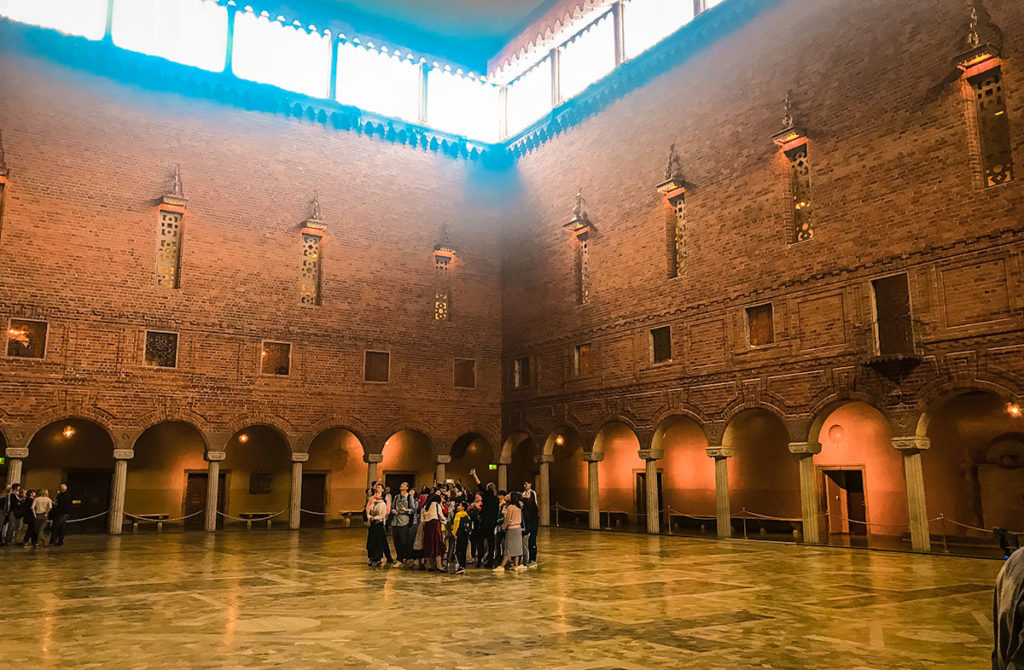 Tourists gathered in the middle of the City Hall's Blue Room in Sweden