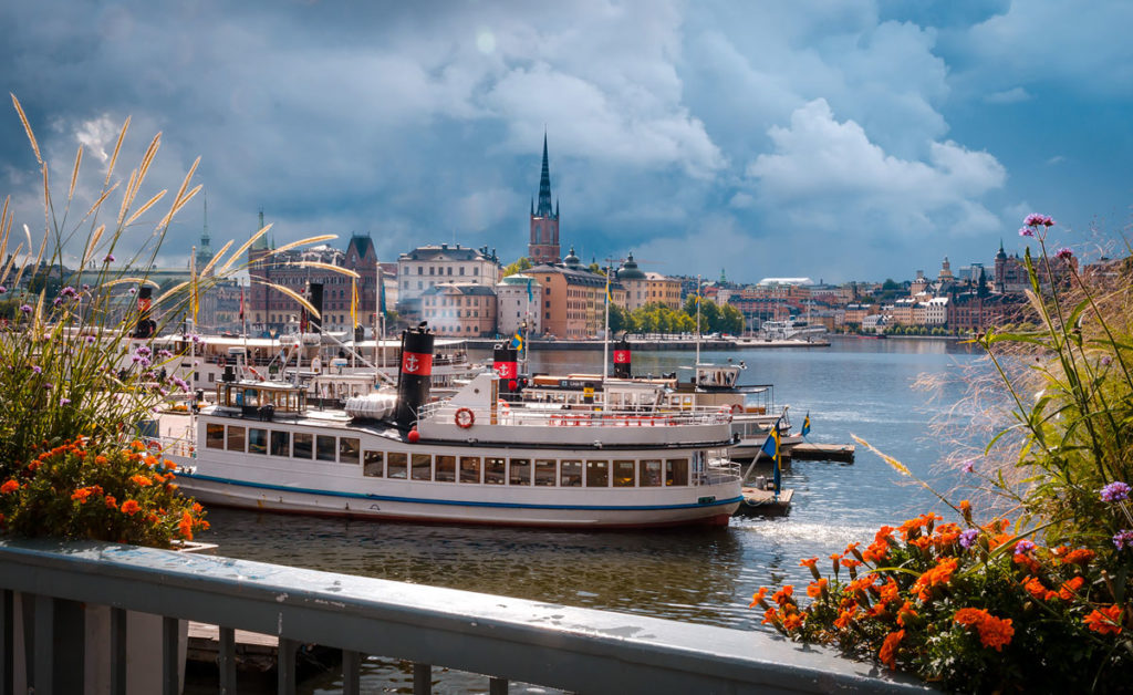 View of ferry boats on the harbor and huge building surrounding it