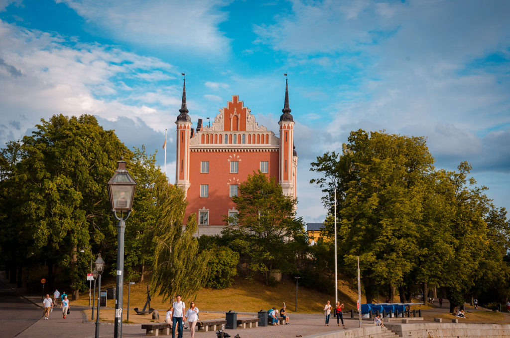 View of Almiralty House with people walking and relaxing around the building