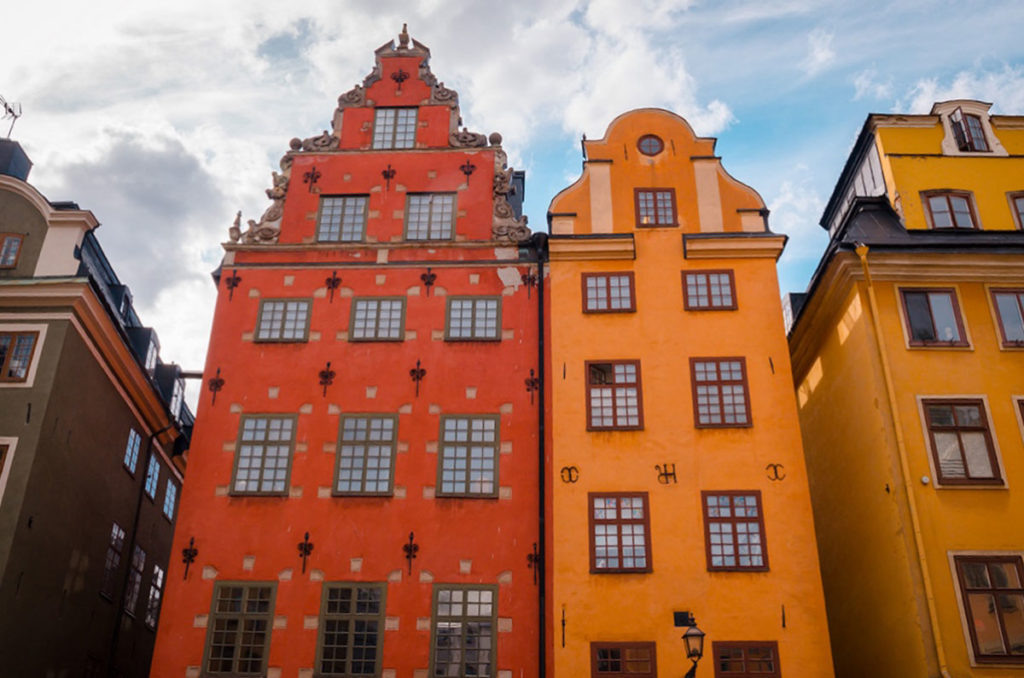 Row of colorful tall private home buildings in Stockholm