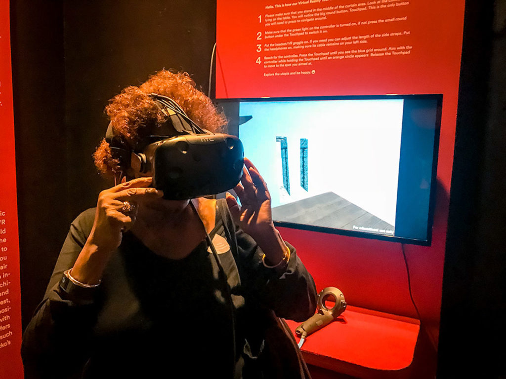 Khadija trying out a Virtual Reality device - Design Museum