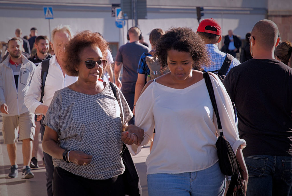 Khadija and her niece Hannah walking in the bustling street of Stockholm