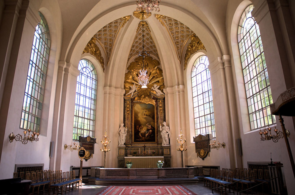 White and gold elaborate altar in the St Mary Magdalene Church