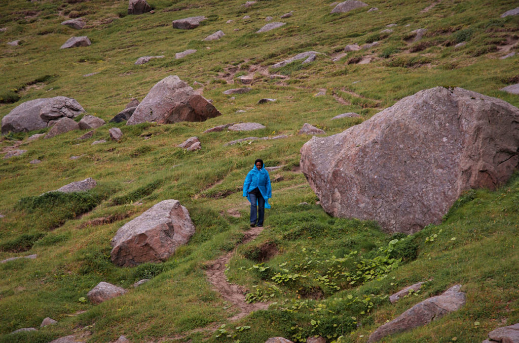 Khadija walking on mountain slope - Norway