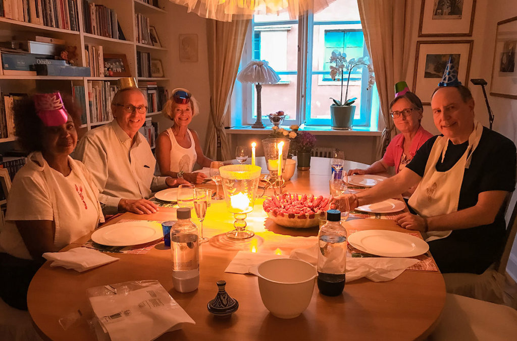 Ed and Khadija having dinner party with friends in Sweden