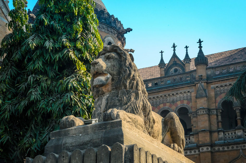 Lion statue in front of a gothic-style building - Mumbai