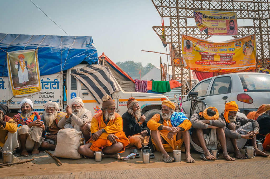 Row of Sadhus with their Tiffens - India
