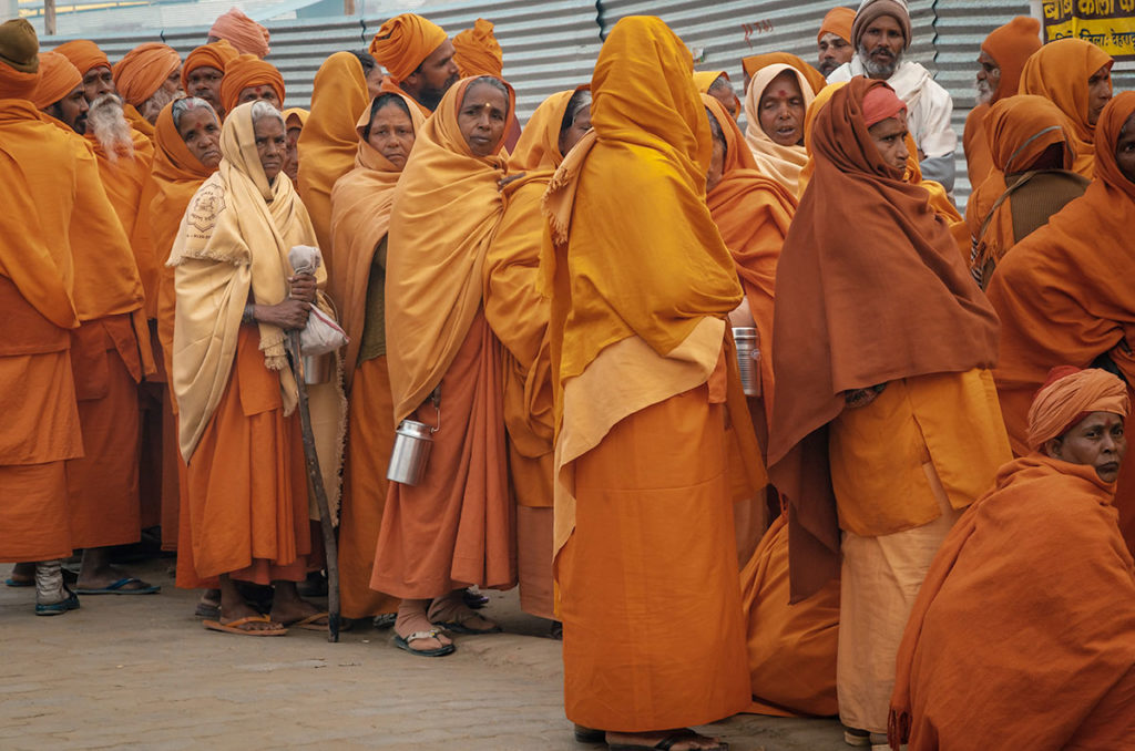 Group of Sadhu women on orange traditional clothing - India