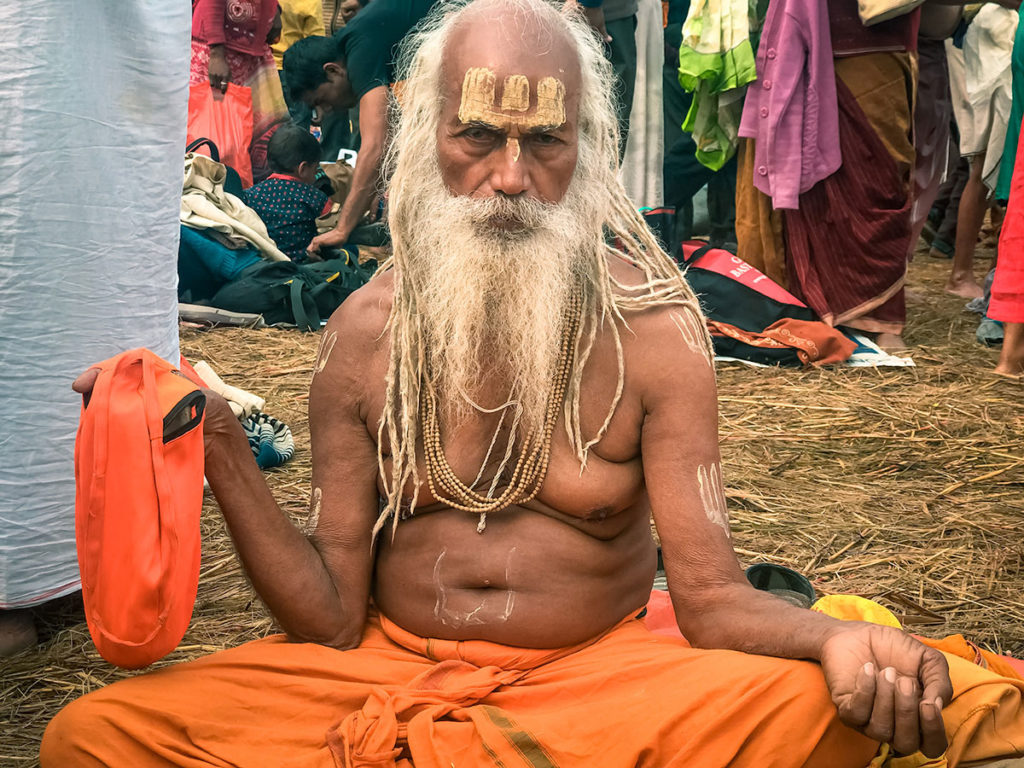 Sadhu sitting on the ground - India