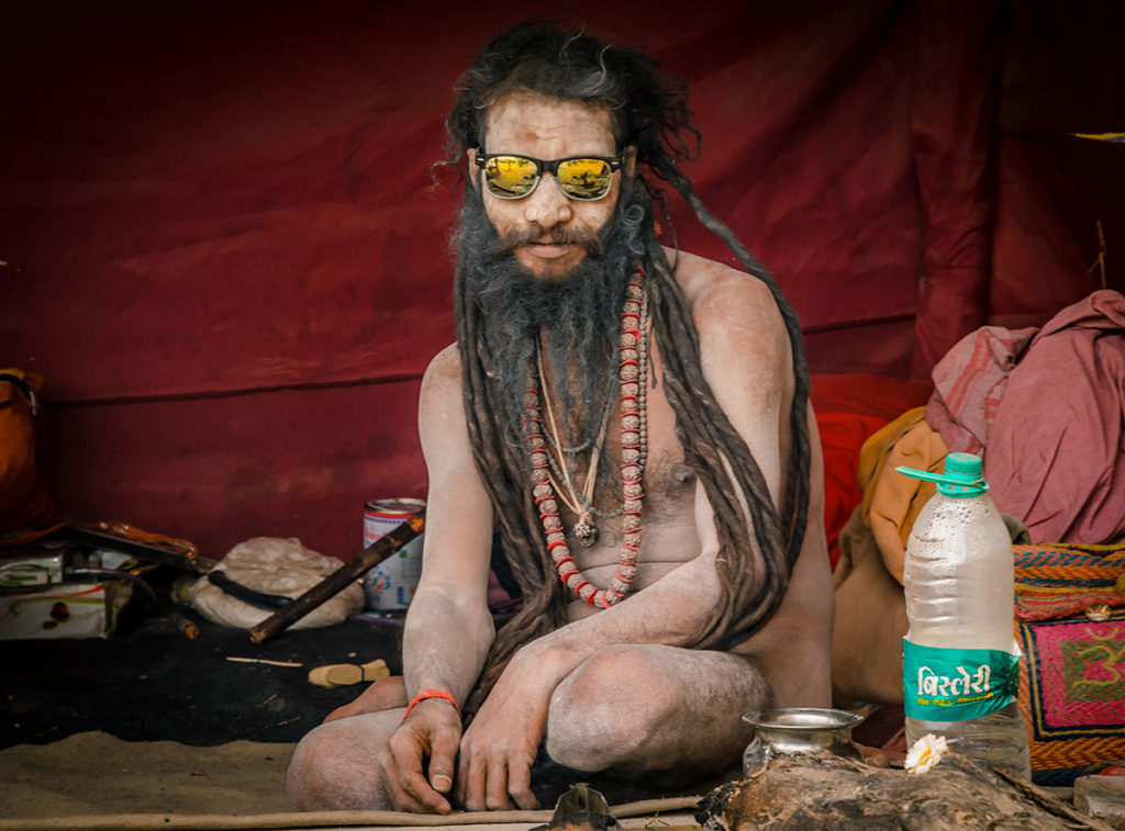 Sadhu with dreadlocks, sunglasses, and huge necklace - India