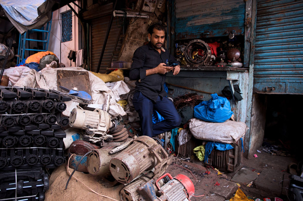 Man in his junk shop - Dharavi