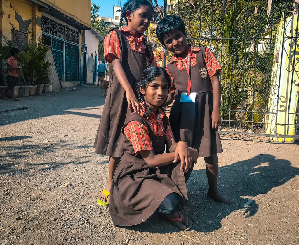 Three primary school girls in uniform - Dharavi
