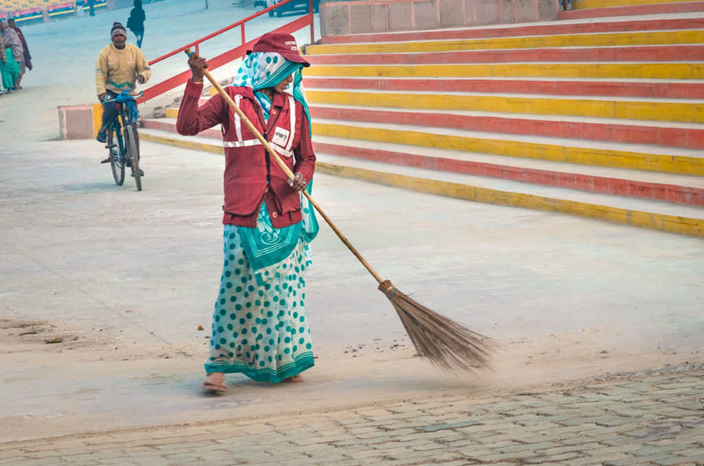 Woman sweeping the ground - India