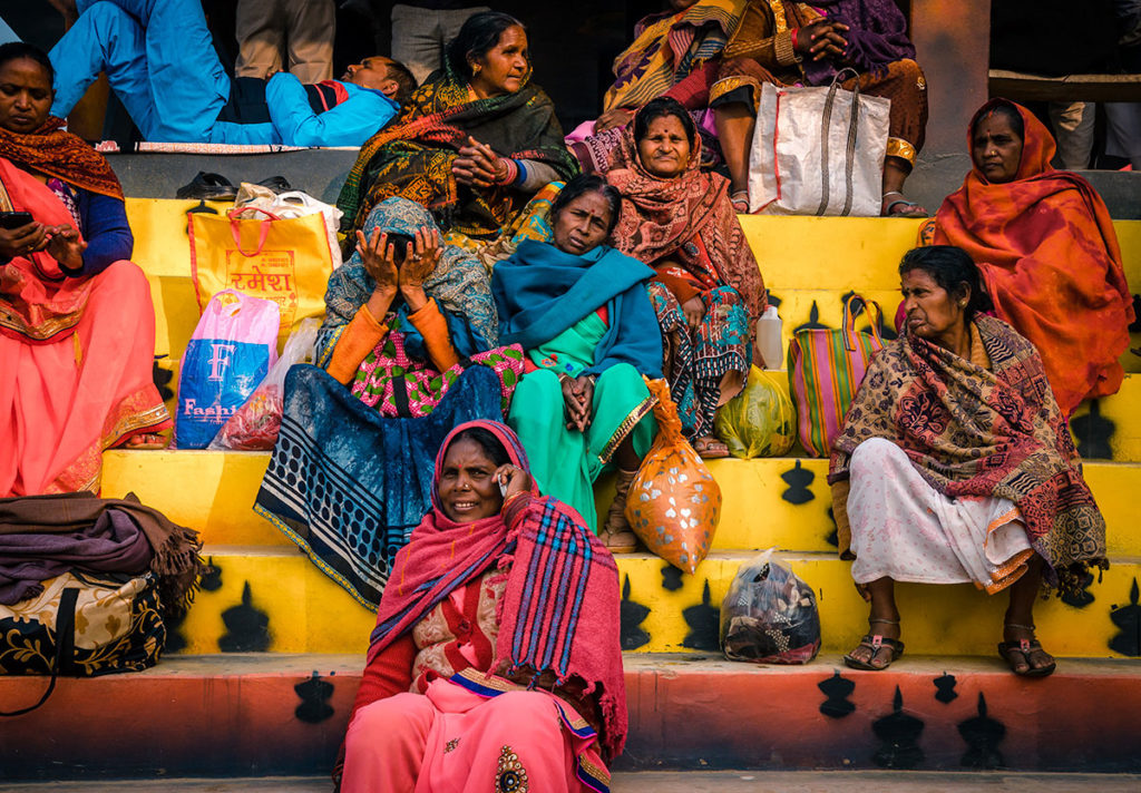 Group women sitting on steps - India