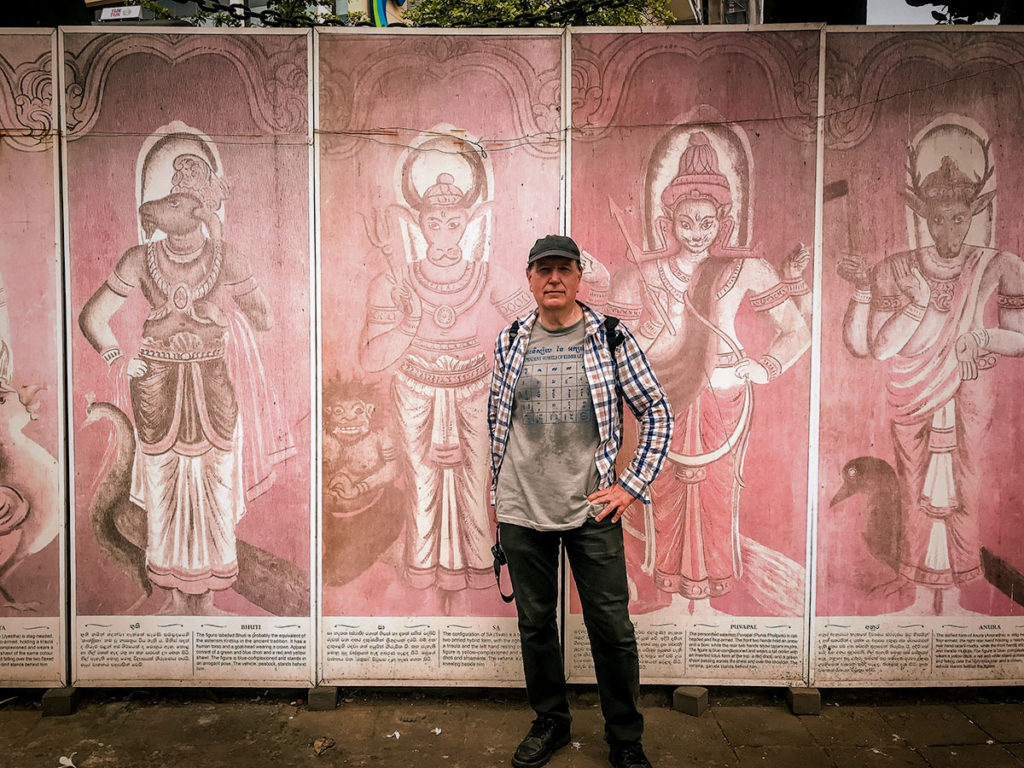 Ed in front of painted wood boards - Colombo