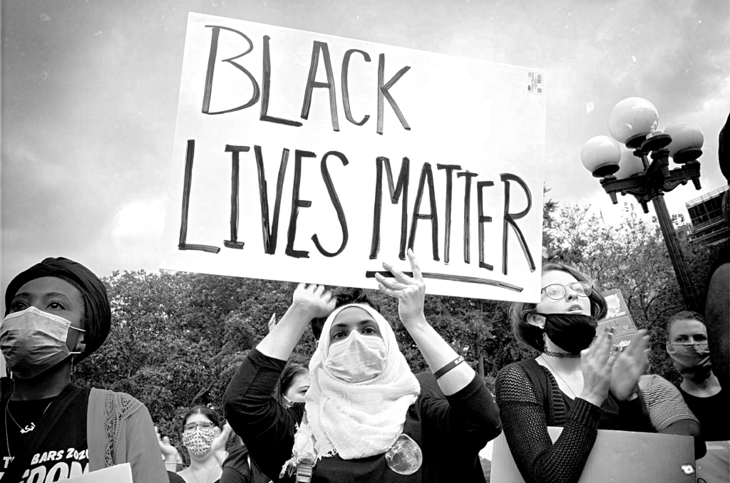 Woman in Hijab with Black Lives Matter Sign