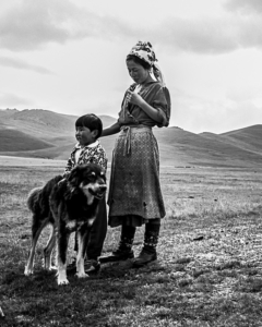 Mother and son living near Song-Kul Lake with their dog