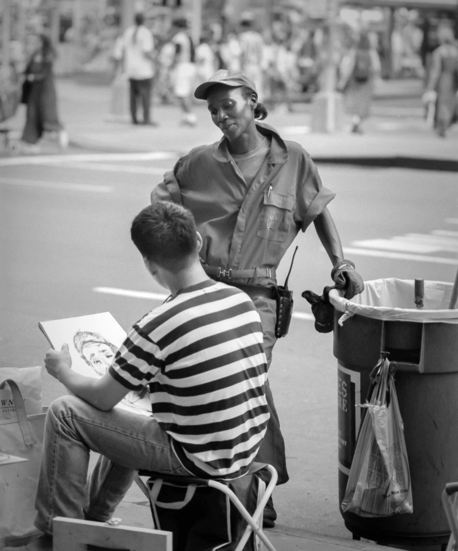 Times Square Street cleaning lady having portrait drawn